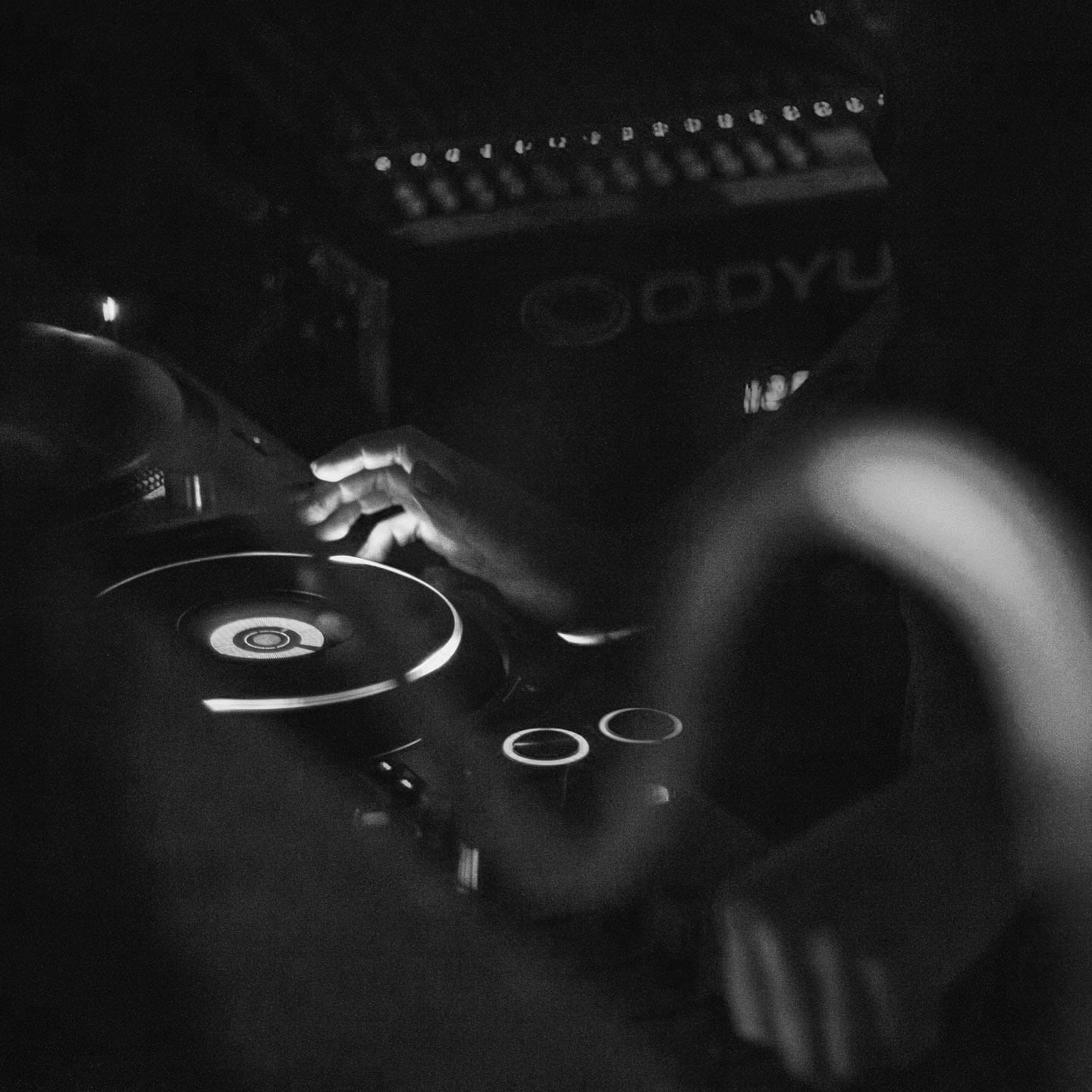 Image of person's hands DJing